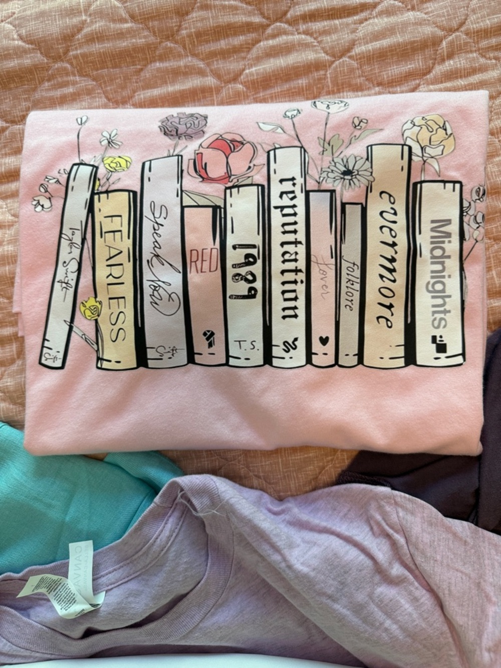 Soft Pink Taylor Swift T-Shirt with Book Illustration album names